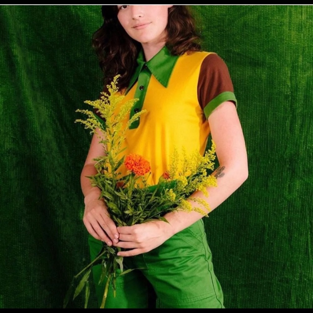 Worn once. Small hole pictured.